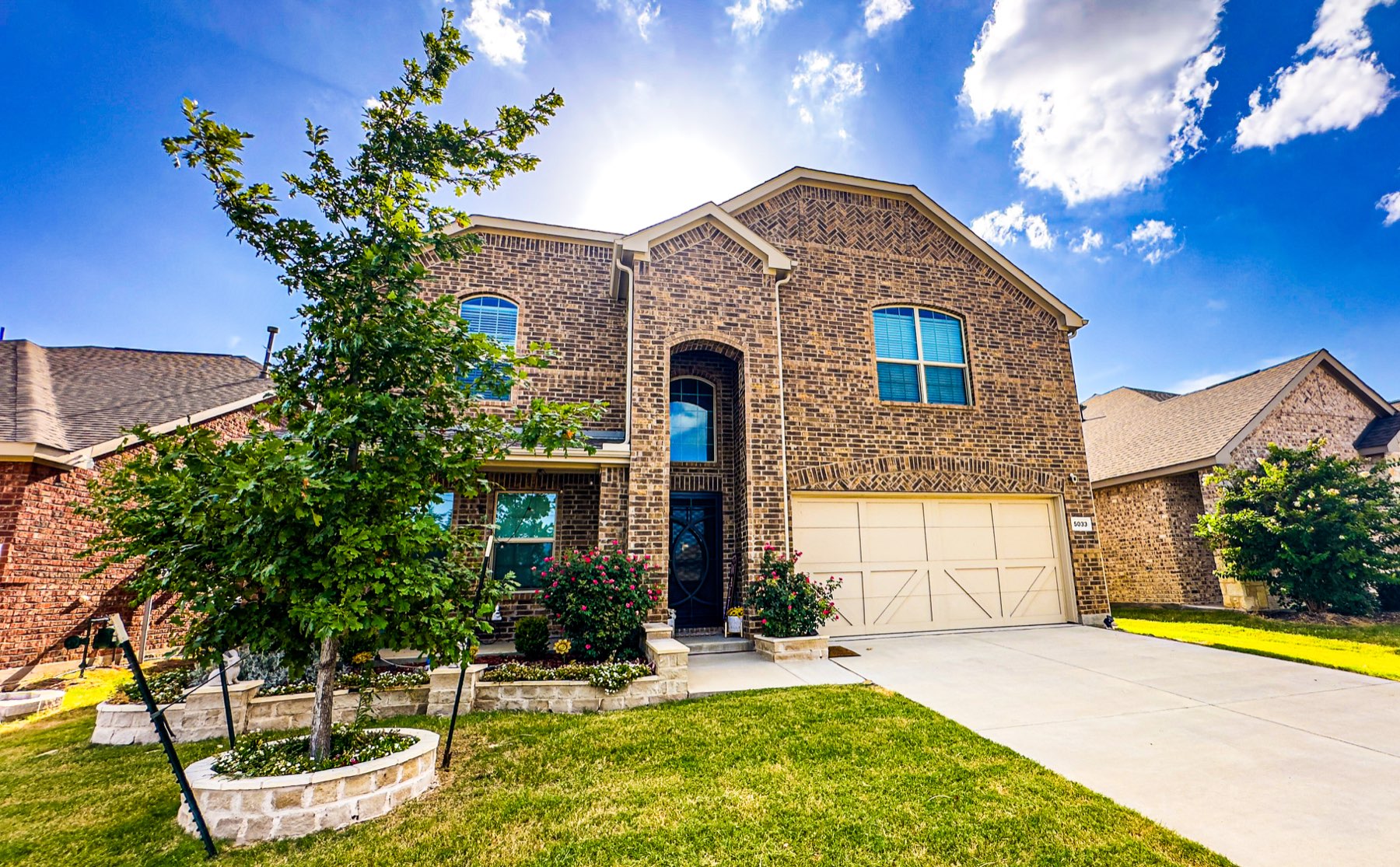 Brick home and landscaped front yard